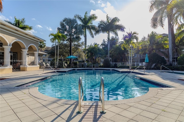 view of swimming pool featuring a patio