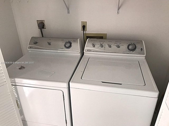 washroom featuring laundry area and washer and dryer