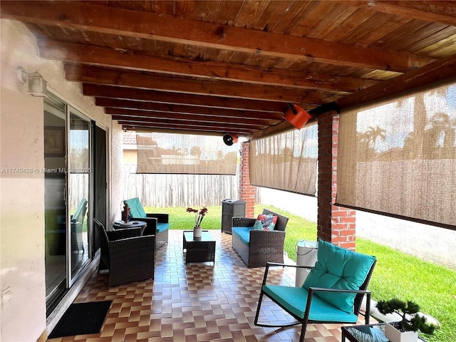 view of patio / terrace featuring outdoor lounge area and fence