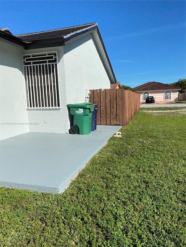 view of home's exterior with a lawn