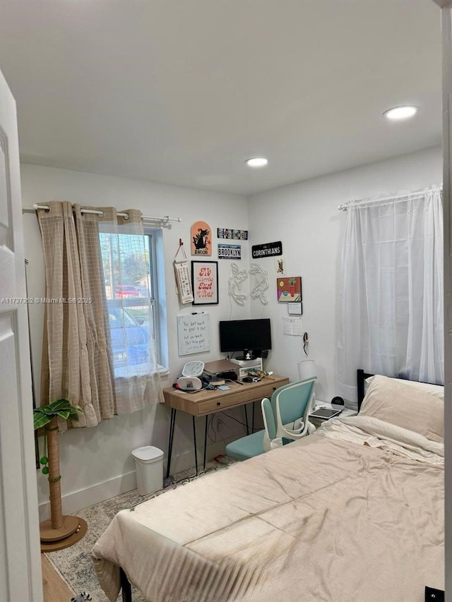 bedroom with hardwood / wood-style flooring