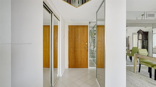 hallway featuring light tile patterned flooring