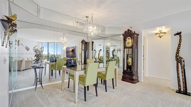 dining room with light carpet, an inviting chandelier, and a wall of windows