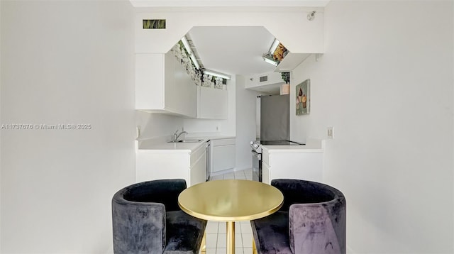 tiled dining room with sink