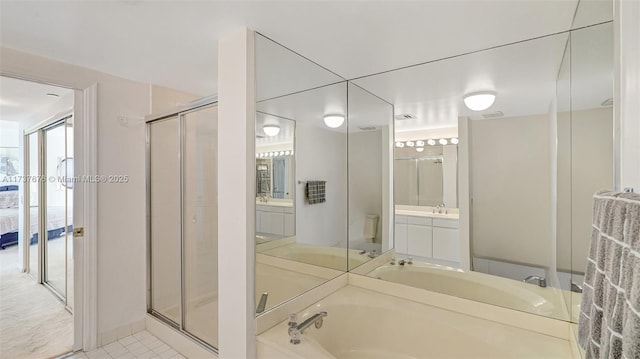 full bathroom featuring vanity, toilet, tile patterned floors, and plus walk in shower