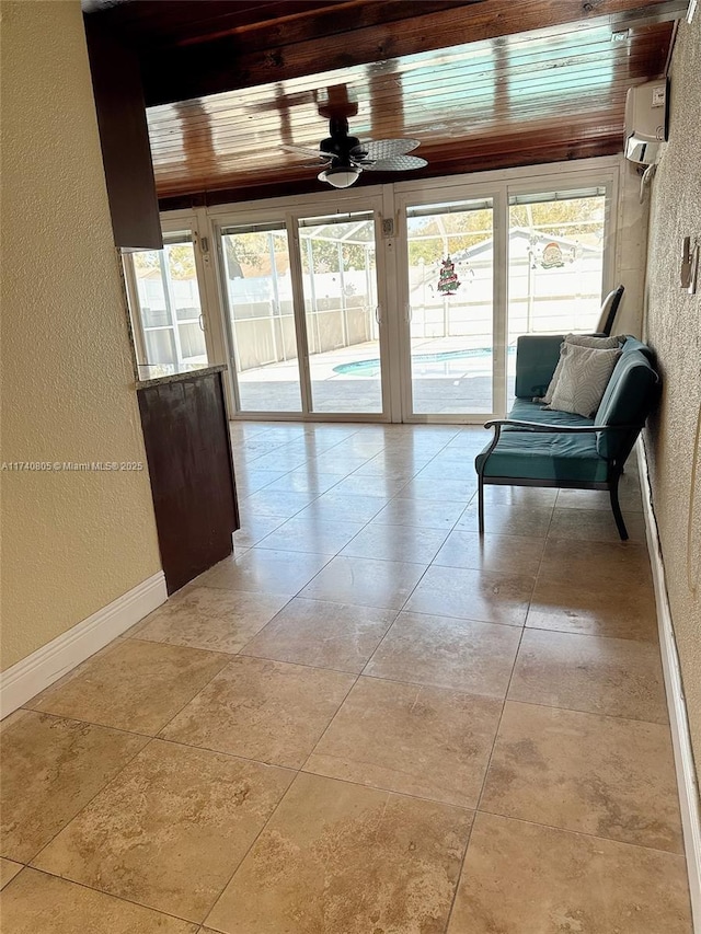 interior space with wooden ceiling and an AC wall unit