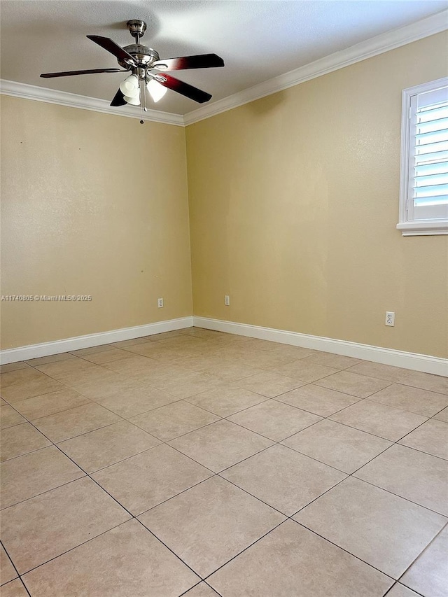 tiled empty room with crown molding and ceiling fan