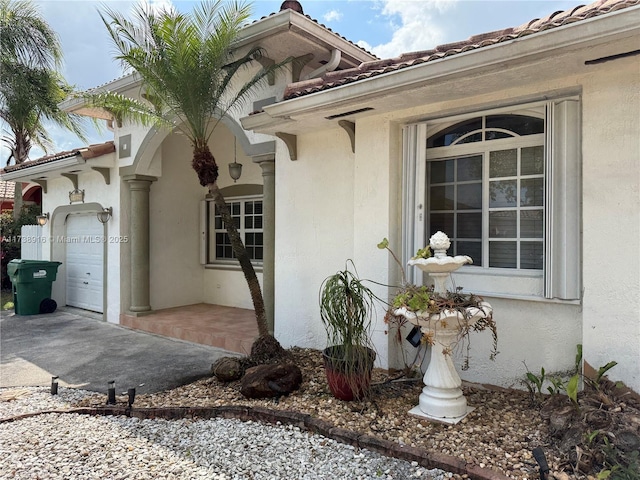 view of side of home featuring a garage