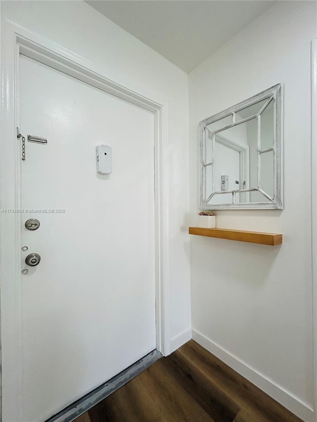 interior space with dark hardwood / wood-style flooring