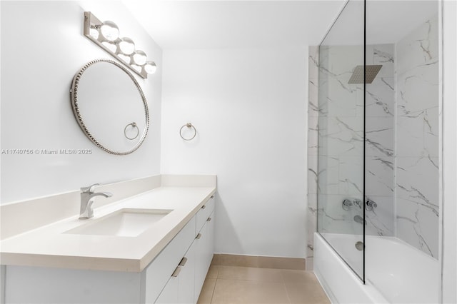 bathroom featuring tiled shower / bath combo, vanity, and tile patterned flooring