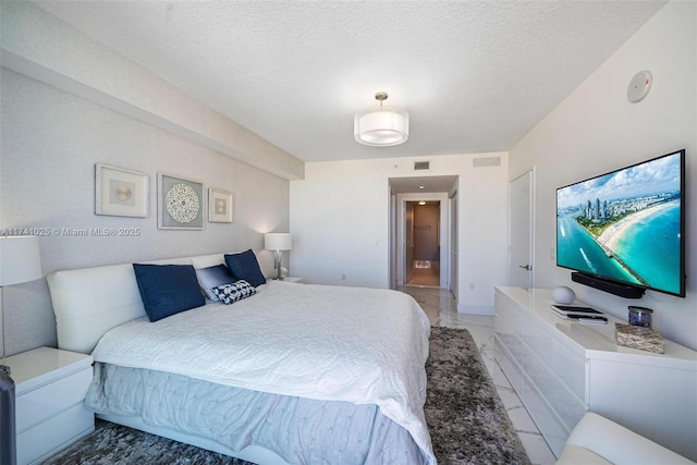 bedroom featuring a textured ceiling