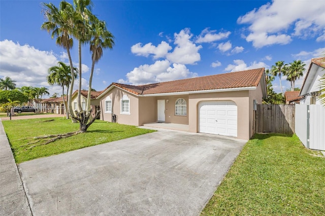 view of front of house featuring a garage and a front lawn