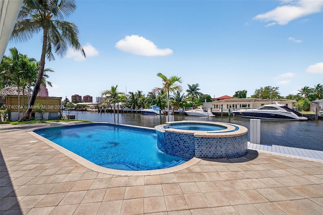 2816 NE 24th Pl, Fort Lauderdale, FL 33305 - view of swimming pool with a pool with connected hot tub and a water view