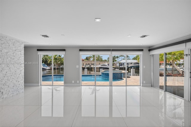 2816 NE 24th Pl, Fort Lauderdale, FL 33305 - tiled spare room featuring healthy amount of natural light and recessed lighting