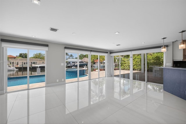 2816 NE 24th Pl, Fort Lauderdale, FL 33305 - tiled empty room featuring healthy amount of natural light