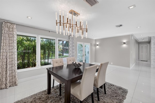 2816 NE 24th Pl, Fort Lauderdale, FL 33305 - dining area with plenty of natural light, tile patterned flooring, crown molding, a chandelier, and recessed lighting