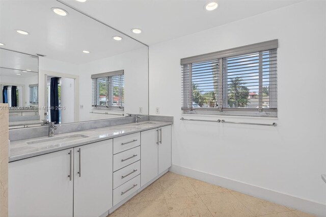 2816 NE 24th Pl, Fort Lauderdale, FL 33305 - bathroom with double vanity, recessed lighting, and tile patterned flooring