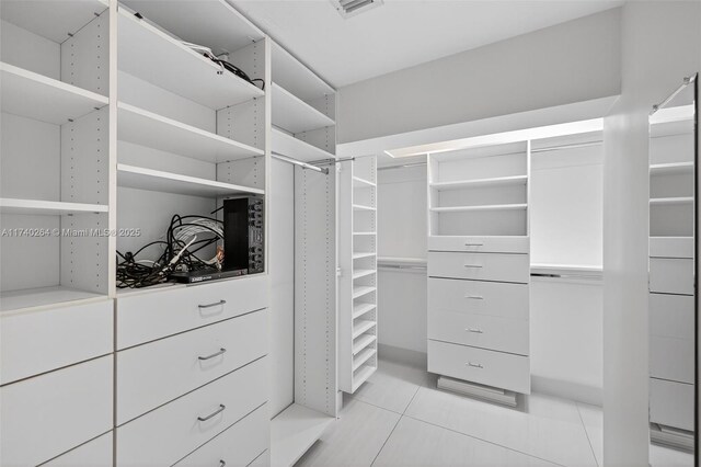 2816 NE 24th Pl, Fort Lauderdale, FL 33305 - spacious closet featuring light tile patterned floors
