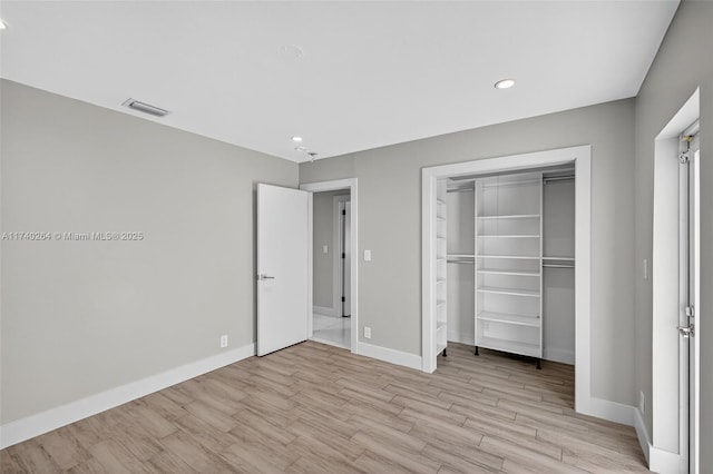 2816 NE 24th Pl, Fort Lauderdale, FL 33305 - unfurnished bedroom featuring light wood-style flooring, a closet, and recessed lighting