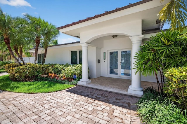 2816 NE 24th Pl, Fort Lauderdale, FL 33305 - property entrance featuring french doors and stucco siding