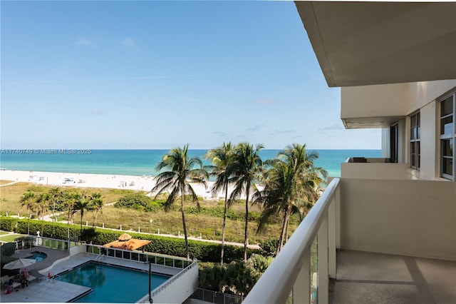 balcony with a beach view and a water view