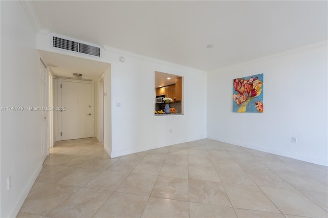 tiled empty room with ornamental molding