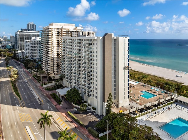 view of property featuring a water view and a view of the beach