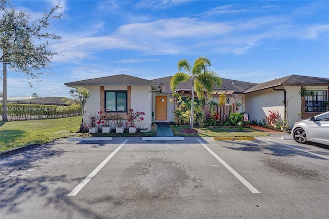 single story home with a front yard