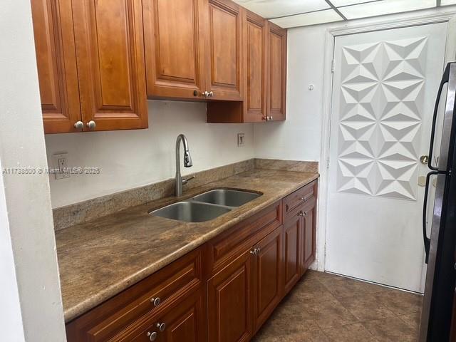 kitchen with sink and stainless steel fridge