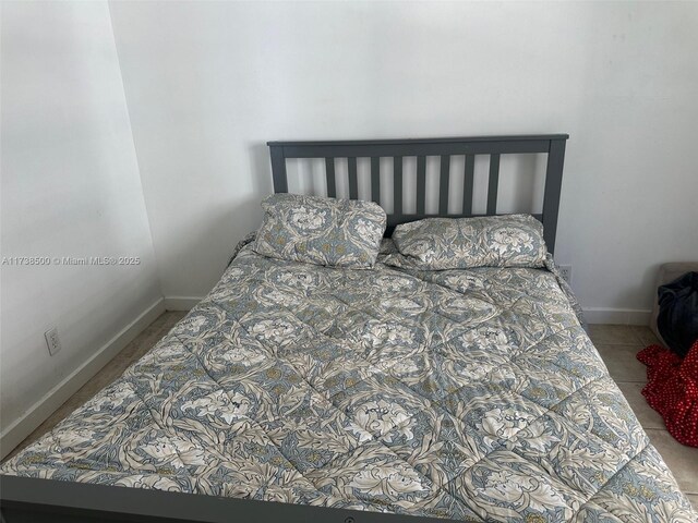 bedroom with tile patterned floors