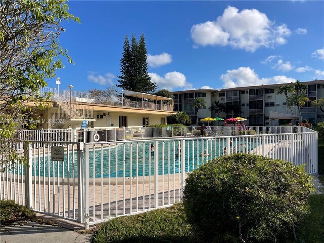 17090 NE 14th Ave Unit 314, Miami, FL 33162 - community pool featuring fence