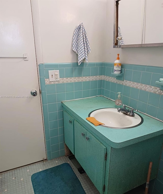 17090 NE 14th Ave Unit 314, Miami, FL 33162 - bathroom with tile patterned flooring, vanity, tile walls, and a wainscoted wall
