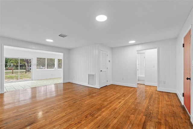 unfurnished living room featuring light hardwood / wood-style flooring