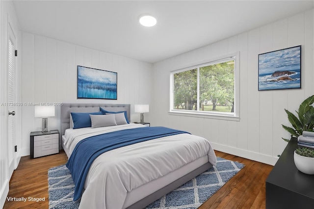 bedroom featuring dark hardwood / wood-style flooring