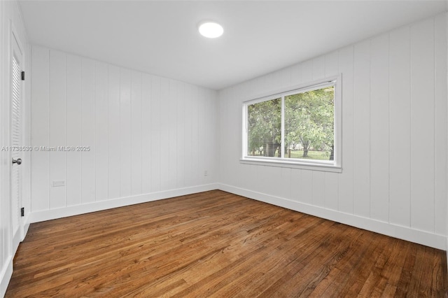 unfurnished room featuring hardwood / wood-style floors