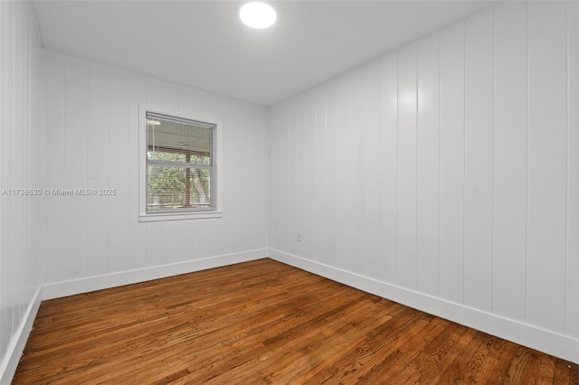 empty room featuring hardwood / wood-style flooring