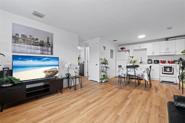 living room with light hardwood / wood-style floors