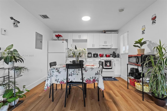 kitchen featuring white cabinetry, white appliances, and light hardwood / wood-style flooring