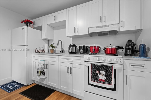 kitchen featuring sink, white cabinets, white appliances, and light hardwood / wood-style flooring