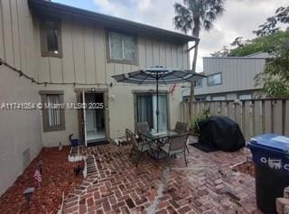 rear view of property featuring a patio