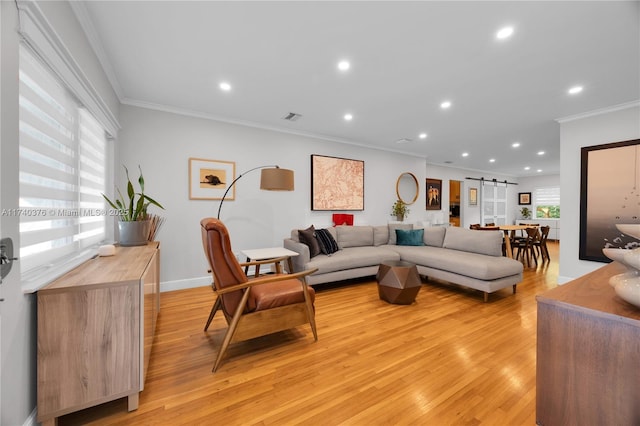 1249 Venetia Ave, Coral Gables, FL 33134 - living room with ornamental molding, a barn door, plenty of natural light, and light hardwood / wood-style flooring