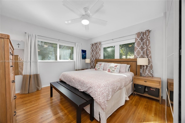 bedroom with hardwood / wood-style floors and ceiling fan