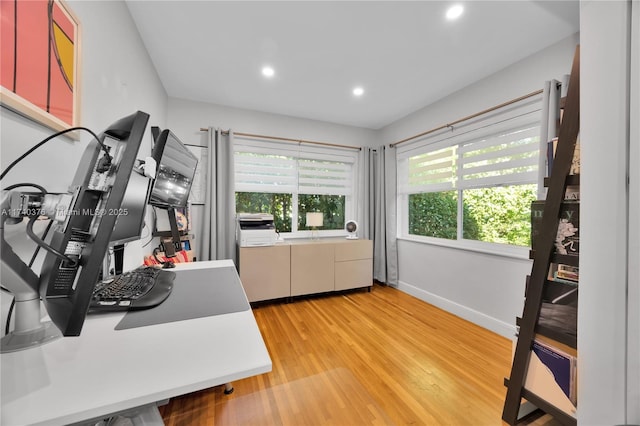 office with light wood-type flooring