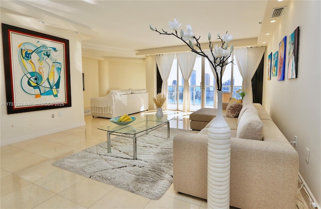 living room featuring an inviting chandelier and light tile patterned floors