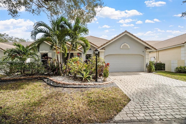 ranch-style house featuring a garage