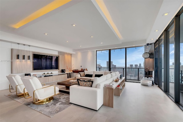 living room featuring floor to ceiling windows