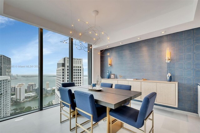 68 SE 6th St Unit 3911, Miami, FL 33131 - dining area featuring expansive windows and a water view