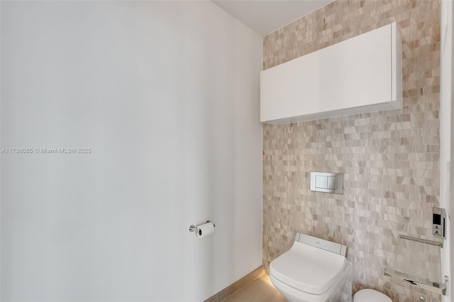 68 SE 6th St Unit 3911, Miami, FL 33131 - bathroom with tile walls and toilet
