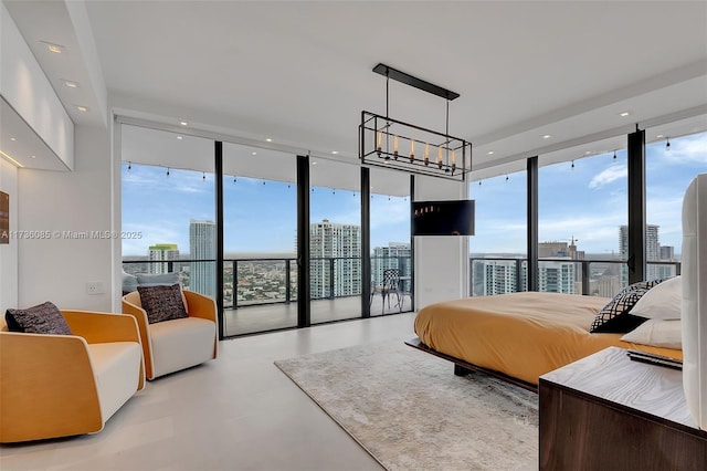 68 SE 6th St Unit 3911, Miami, FL 33131 - bedroom with expansive windows, access to outside, and multiple windows