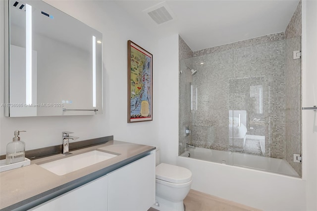 68 SE 6th St Unit 3911, Miami, FL 33131 - full bathroom featuring vanity, bath / shower combo with glass door, and toilet